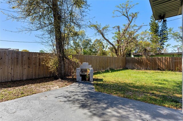 view of yard featuring a fenced backyard and a patio