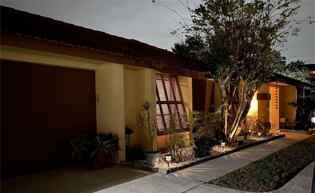 view of side of property with stucco siding