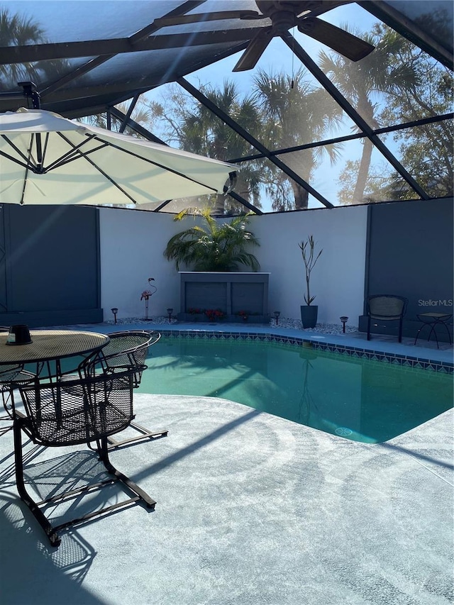 pool with a lanai and a patio