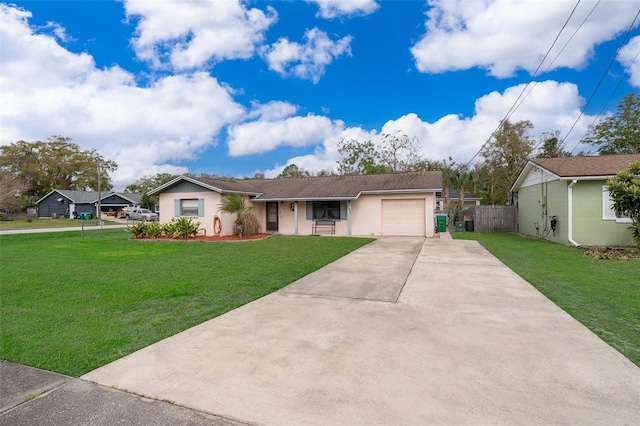 single story home featuring an attached garage, fence, concrete driveway, and a front yard