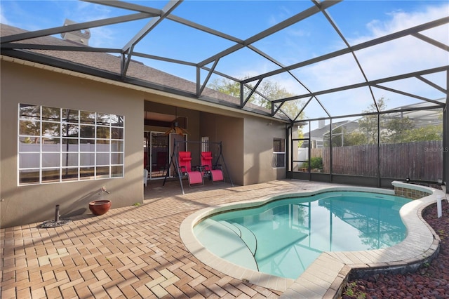 view of pool with a fenced in pool, a lanai, a patio area, and fence