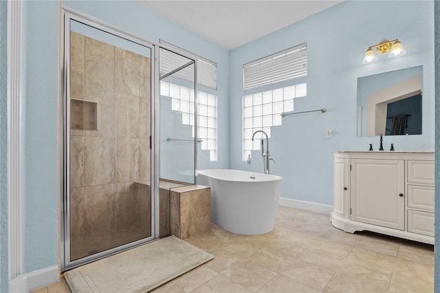 full bath with a soaking tub, baseboards, a shower stall, and vanity