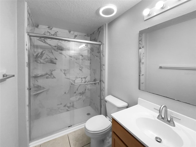 full bathroom with toilet, a marble finish shower, a textured ceiling, and vanity