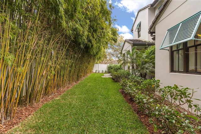 view of yard with fence