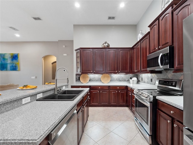 kitchen featuring light countertops, visible vents, appliances with stainless steel finishes, and a sink