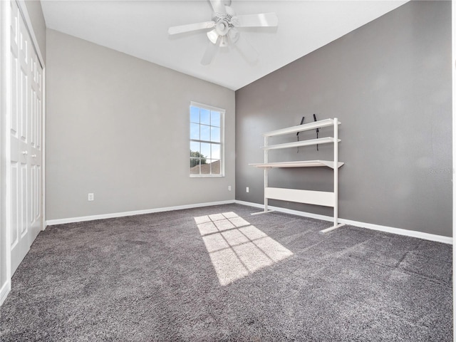 unfurnished bedroom with carpet flooring, baseboards, a closet, and ceiling fan