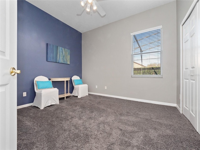 unfurnished room featuring carpet flooring, a ceiling fan, and baseboards