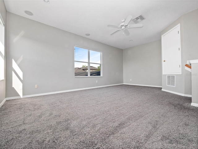 unfurnished living room with visible vents, baseboards, carpet, and ceiling fan