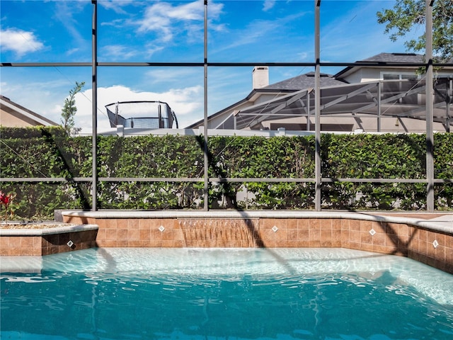 pool featuring glass enclosure