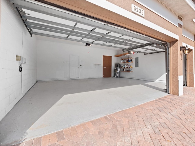 garage with electric panel and a garage door opener