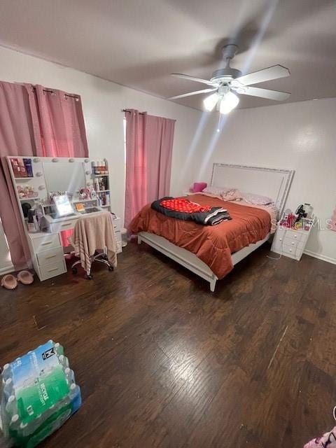 bedroom featuring a ceiling fan and wood finished floors