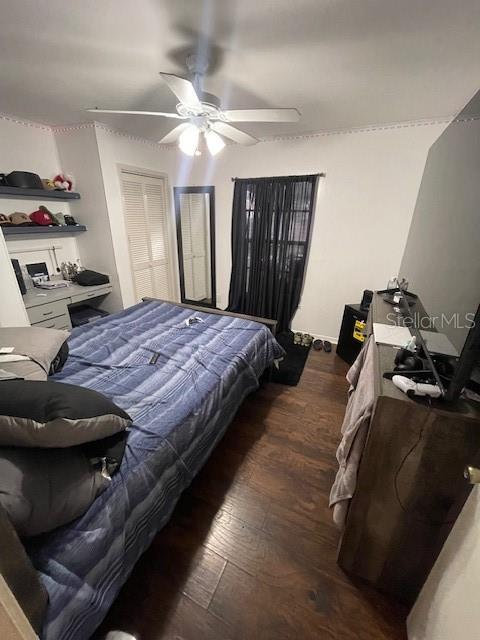 bedroom featuring ceiling fan and wood finished floors