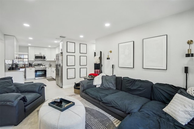 living room with visible vents and recessed lighting