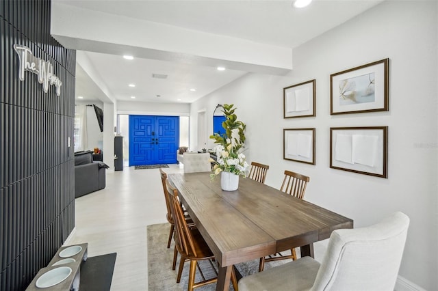 dining room featuring light wood-style flooring and recessed lighting