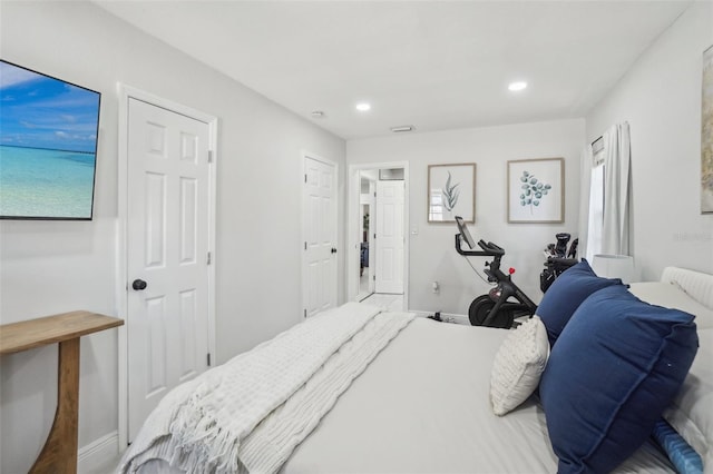 bedroom with baseboards and recessed lighting