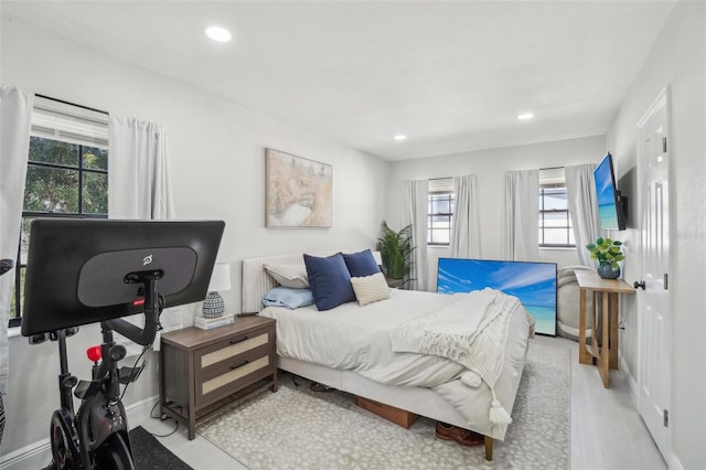 bedroom featuring radiator and recessed lighting