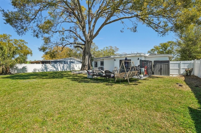 view of yard with a fenced backyard