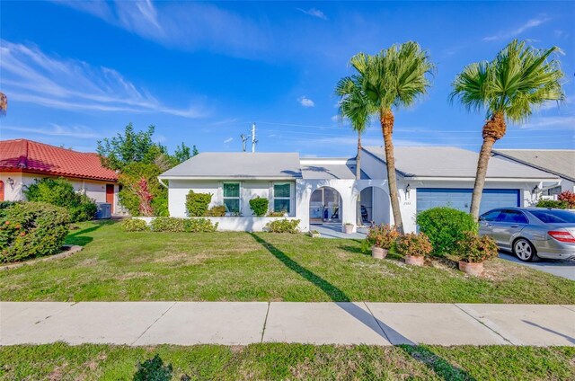 2502 SW 23rd Cranbrook Dr, Boynton Beach, FL 33436 - single story home with a front yard, an attached garage, and stucco siding