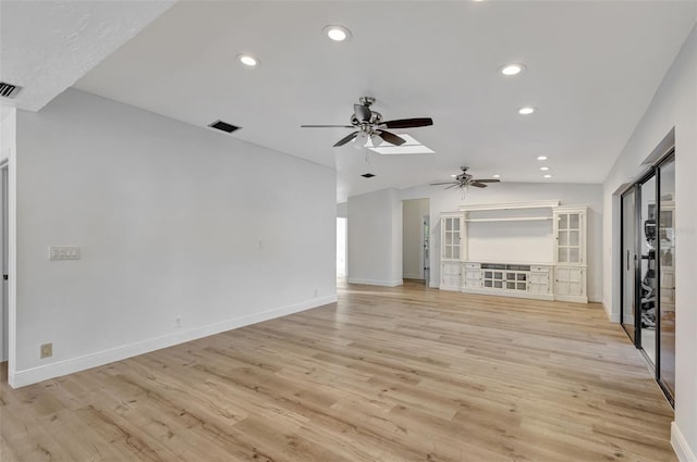 2502 SW 23rd Cranbrook Dr, Boynton Beach, FL 33436 - unfurnished living room featuring ceiling fan, light wood-type flooring, visible vents, recessed lighting, and lofted ceiling