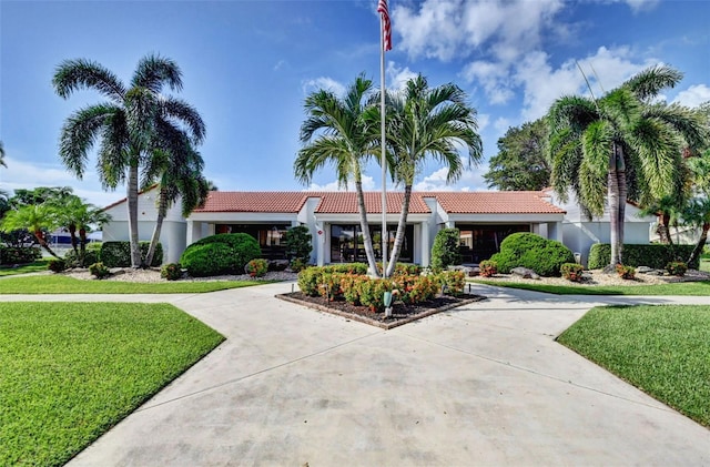 2502 SW 23rd Cranbrook Dr, Boynton Beach, FL 33436 - exterior space featuring a front lawn, stucco siding, and a tile roof