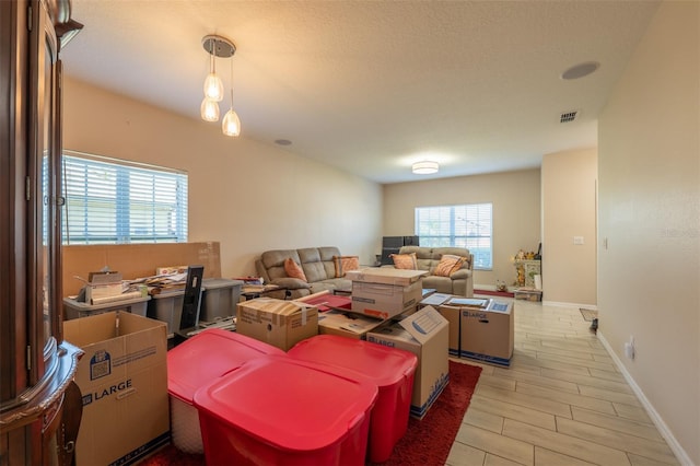 living room featuring visible vents and baseboards