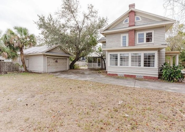 view of front facade featuring a garage, crawl space, an outdoor structure, and a chimney