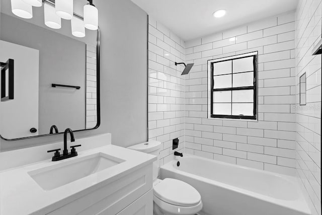 bathroom featuring toilet, shower / bathtub combination, and vanity