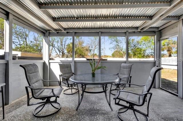 sunroom / solarium with a healthy amount of sunlight