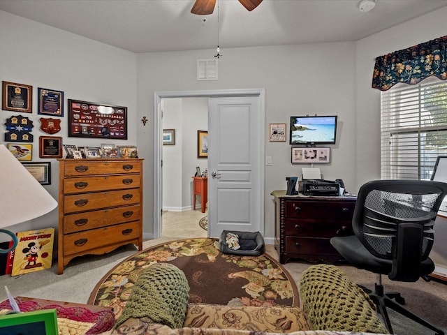 office space featuring visible vents, ceiling fan, baseboards, and light tile patterned floors