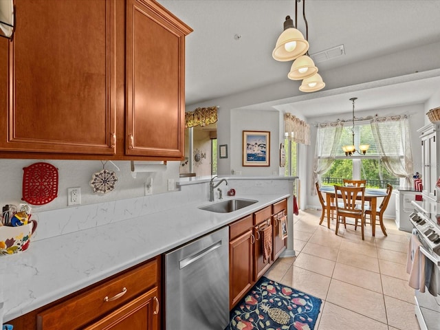 kitchen with light countertops, appliances with stainless steel finishes, and a sink