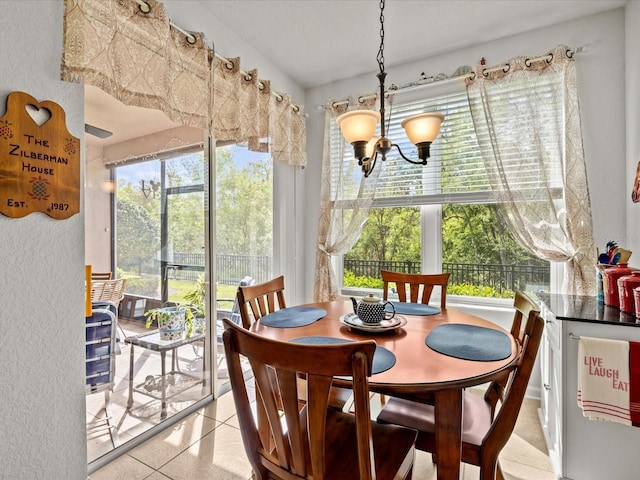 sunroom featuring a chandelier