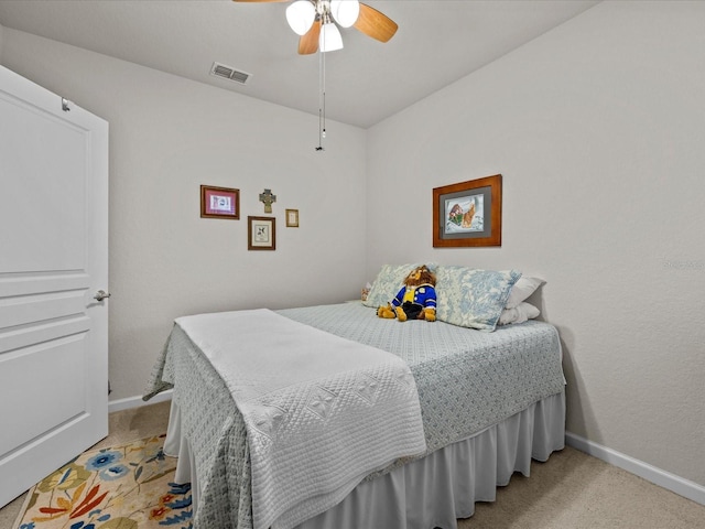 bedroom with baseboards, visible vents, ceiling fan, and light colored carpet