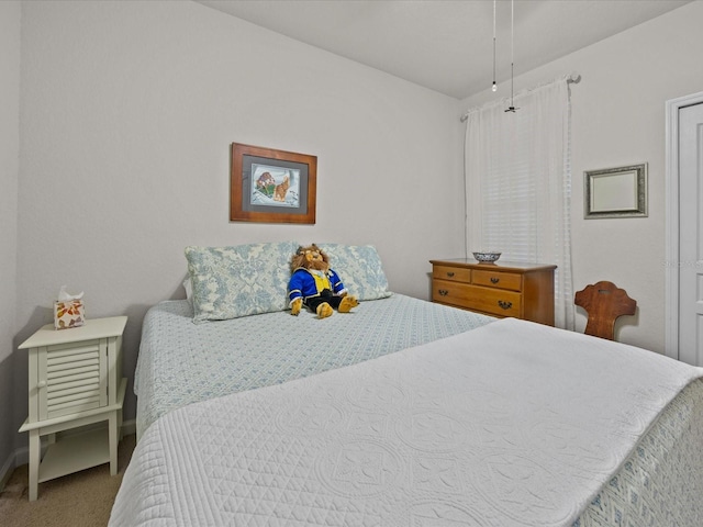 carpeted bedroom with baseboards