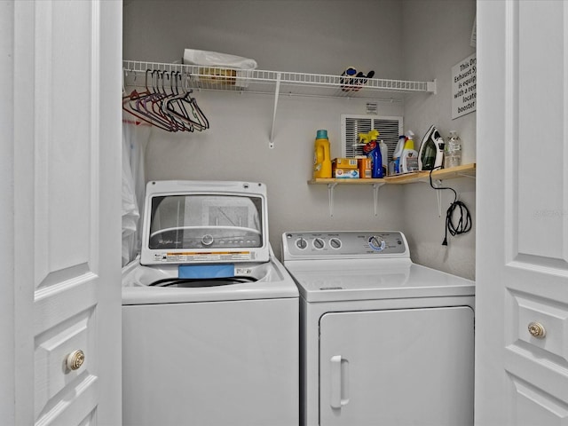 clothes washing area featuring laundry area and independent washer and dryer