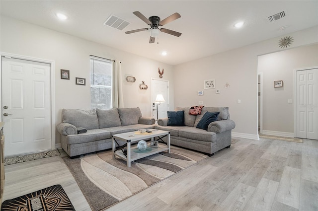 living area featuring visible vents, recessed lighting, light wood-style flooring, and a ceiling fan