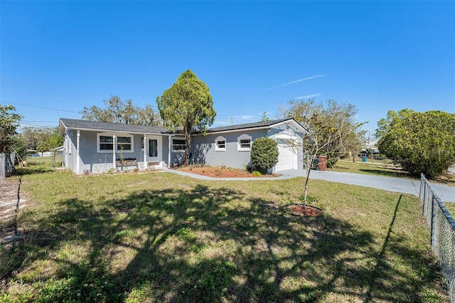 ranch-style house with stucco siding, an attached garage, driveway, and fence