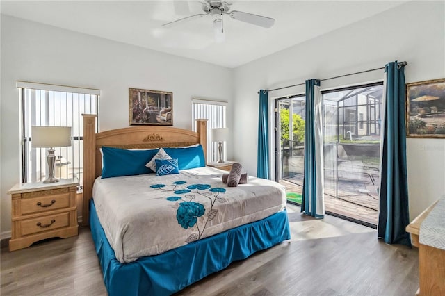 bedroom with access to exterior, a ceiling fan, and wood finished floors