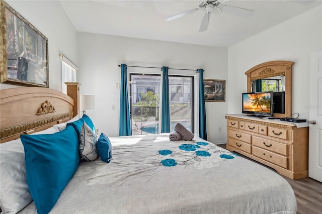 bedroom featuring ceiling fan, wood finished floors, and access to exterior