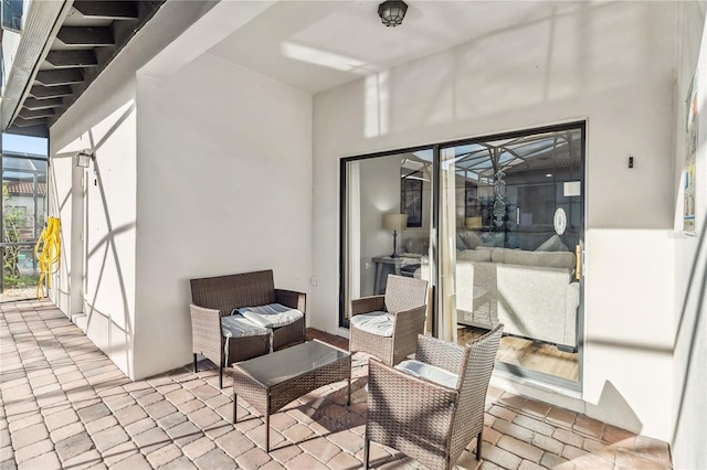 view of patio / terrace with glass enclosure