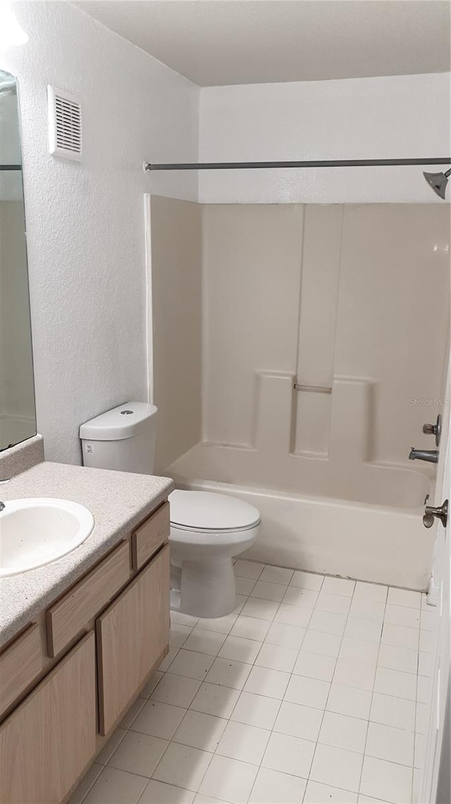 full bath featuring tile patterned flooring, toilet, bathing tub / shower combination, vanity, and visible vents