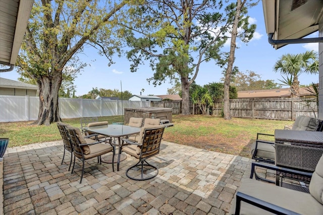 view of patio featuring outdoor dining space and a fenced backyard