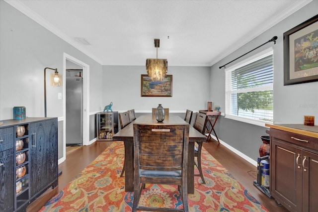 dining space with dark wood-style floors, wine cooler, baseboards, and crown molding