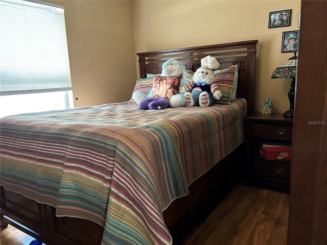 bedroom featuring wood finished floors