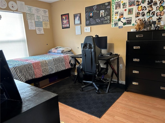 bedroom with wood finished floors