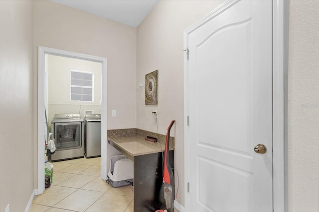 laundry area with laundry area, light tile patterned floors, and separate washer and dryer