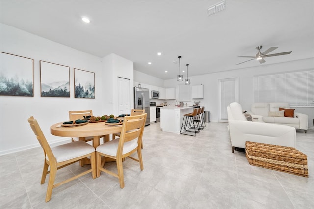 dining room with recessed lighting, visible vents, baseboards, and a ceiling fan