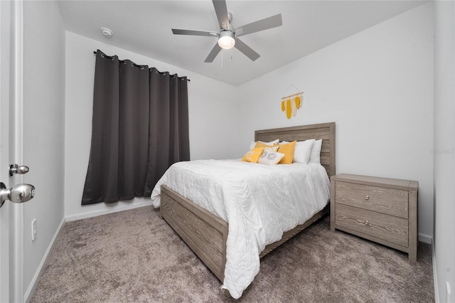 bedroom with a ceiling fan, carpet, and baseboards