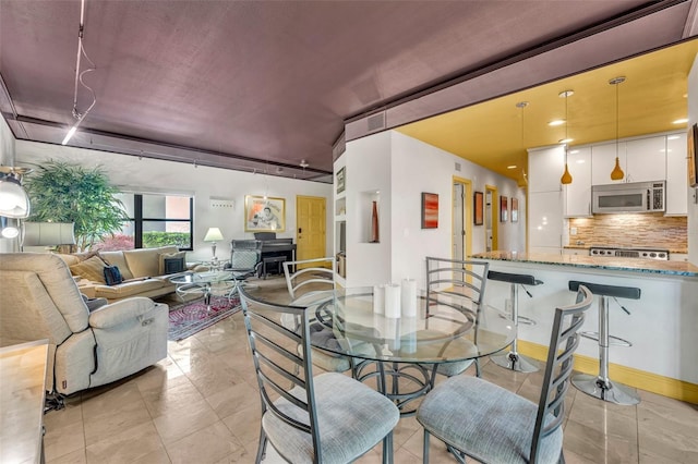 dining room featuring baseboards