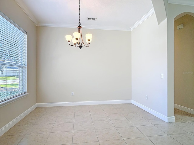 spare room featuring light tile patterned floors, baseboards, arched walkways, and crown molding