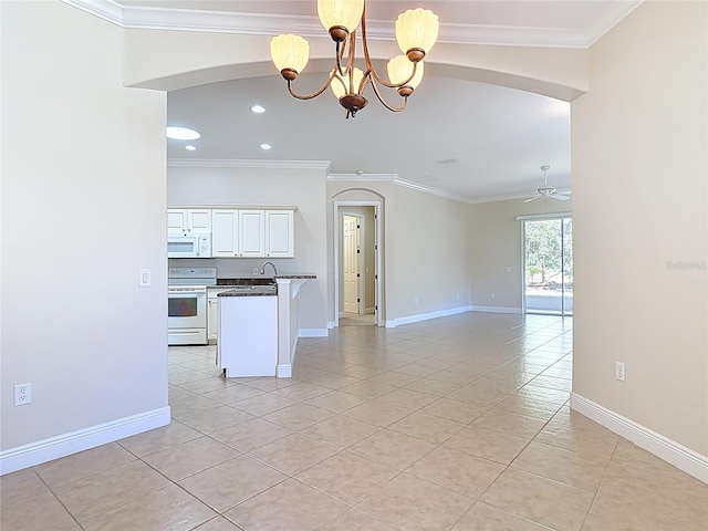 kitchen with dark countertops, ornamental molding, open floor plan, white appliances, and ceiling fan with notable chandelier